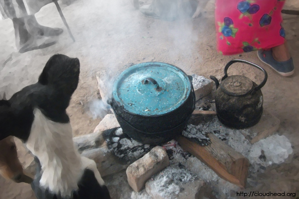 Around the fire, waiting for food in a Wichi village in Hickmann, Argentina