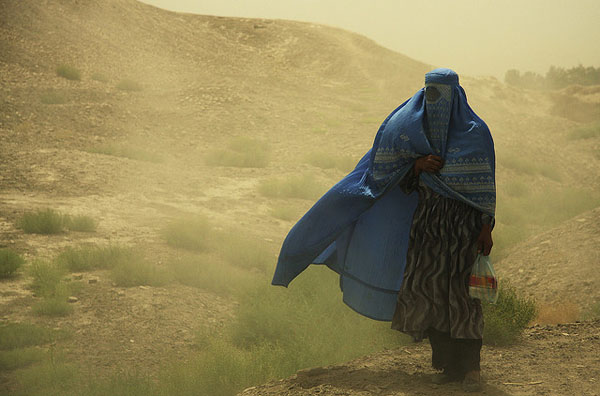 Women in burqa in sandstorm